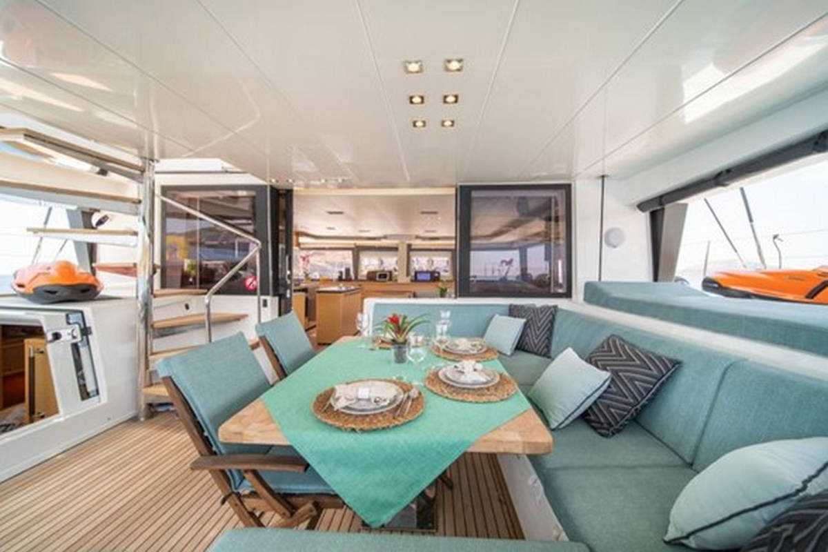 Lagoon 560 S2 Catamaran - Aft Cockpit Lounge & Dining Area | Vernicos Yachts